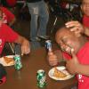 Kids enjoying Gino's Pizza.