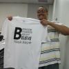 Marshall University student Charles Meyers, a Huntington native, shows off the B4 volunteer t-shirts.