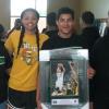 Marshall junior guard Kiana Evans, a Huntington High graduate, takes picture with students who excelled in the a quiz from a video about her. The winner received an framed autographed picture from Evans.