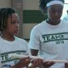 Camryn Veazey and DestinyJones look to complete team building activity.