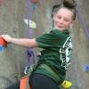 Aailyah Sheffield climbs rock wall during free time of B4 program.